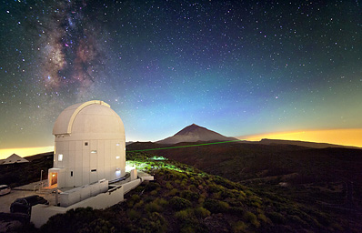 Bob on Tenerife, in ESA Optical Ground Station telescope. Green tracking beam is pointing over 143 km to La Palma. Image ©2011 IQOQI Vienna