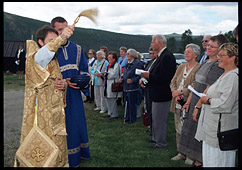 Bishop Hilarion of Vienna and Austria blessing the faithful with holy water
