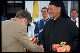 Гости поздравляют монаха Иону после освящения часовни